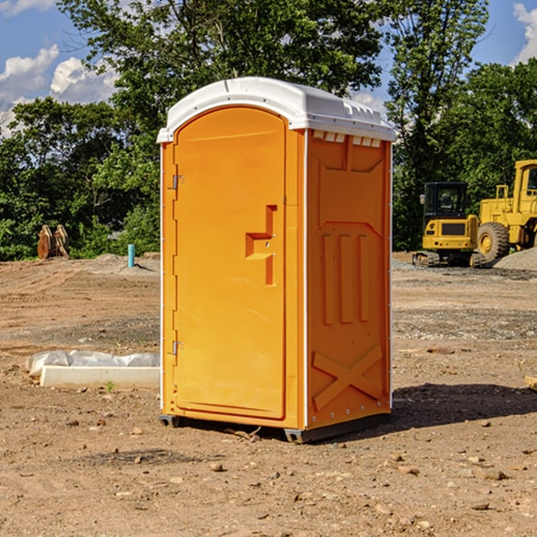 what is the cost difference between standard and deluxe portable restroom rentals in Andrew Iowa